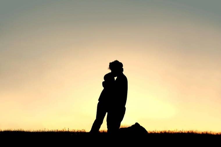 Father kissing his child on the forehead